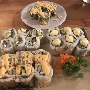 I believe Miami Roll in the background. Salmon Avocado Roll, Philly Roll, and Crunchy Spicy Salmon Roll.