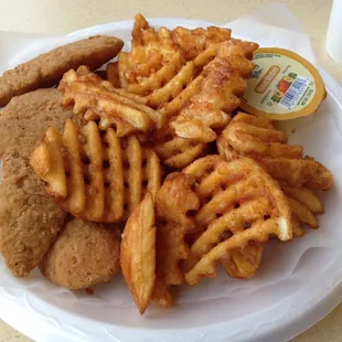 Fried chicken fingers and waffle fries