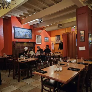 a dining area with tables and chairs