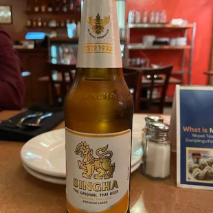 a bottle of beer on a table
