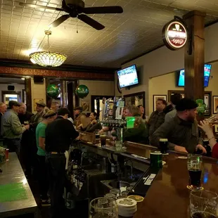a crowd of people at a bar