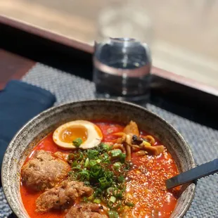 a bowl of ramen with meatballs