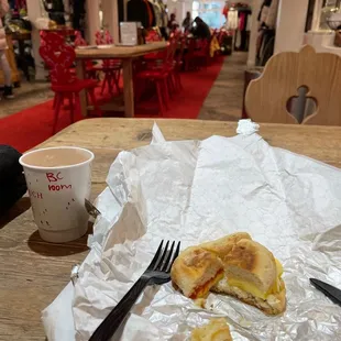 Half eaten tomato, cheese, egg sandwich. It was really good!