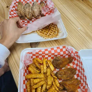 Garlic parm combo with waffle (you get two small waffles). Lemon pepper, cajun, ranch wings with their seasoned fries.