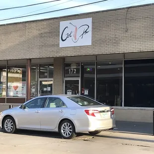 a car parked in front of a restaurant