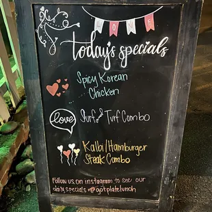 a chalkboard sign for holiday specials