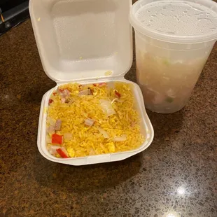 a container of rice and a plastic container of milk