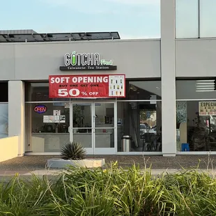 Storefront from the street, parking is on the other side of the building.