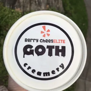 a person holding a white frisbee