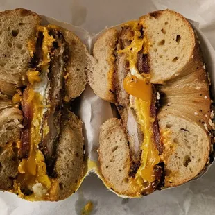 OMFC Fried chicken, egg, cheddar, and bacon on an everything bagel