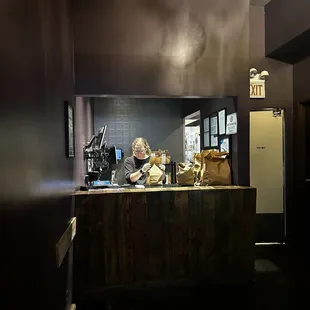 a woman behind the counter