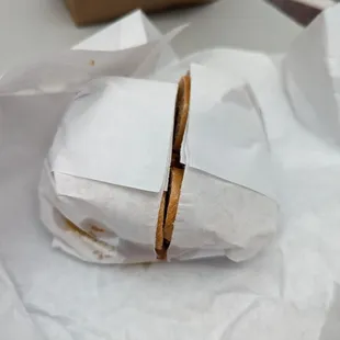 a sandwich wrapped in paper