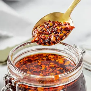 a spoon full of hot sauce