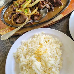 Sizzling bistek tagalog with fried rice!