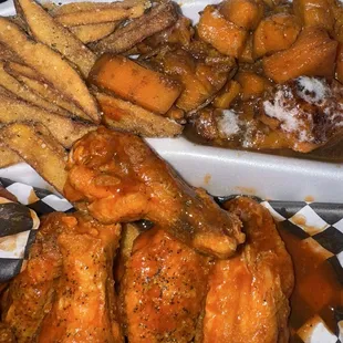 Wings, garlic parmesan fries, yams