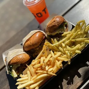 a burger and fries with a drink