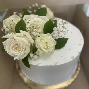 a cake with white roses