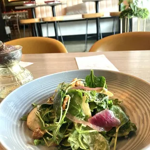 Half Farmer Salad: artisan lettuce, seasonal fruits, walnuts, blue cheese, sherry vinaigrette