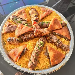 Mixed grill over rice and hawawshi