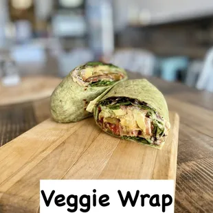 a veggie wrap on a cutting board