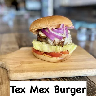 a tex mex burger on a cutting board