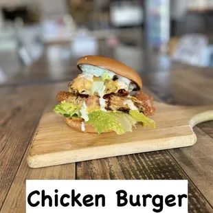 a chicken burger on a cutting board