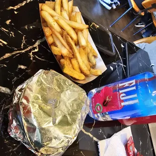 Cheeseburger and fries and water l
