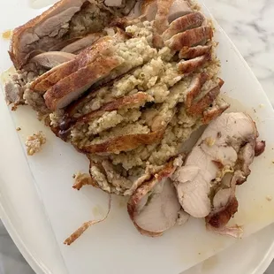 Deboned stuffed chicken with shrimp and rice dressing 10/10 delicious.  Cornbread and crawfish stuffing equally amazing.