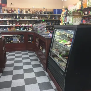 They have a lot of bottles behind the counter. Neat cold case too!
