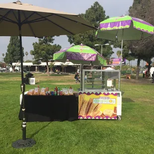a display of churros and umbrellas