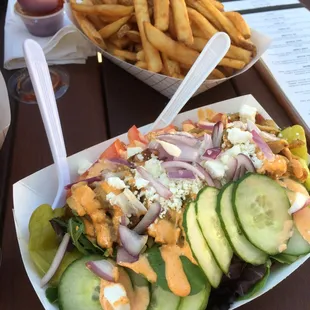 This salad is so tasty! Whatever they marinate the chicken in really makes the dish yummy. Also, don't forget to order French fries.