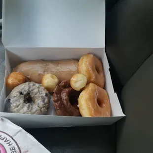 Clockwise: Maple Long John, Two Glazed, Chocolate Old-fashioned, Blueberry Cake (plus three bonus donut holes)