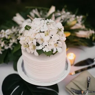a wedding cake with white flowers
