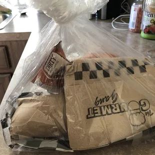 a sandwich wrapped in plastic
