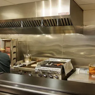 a man working in a commercial kitchen