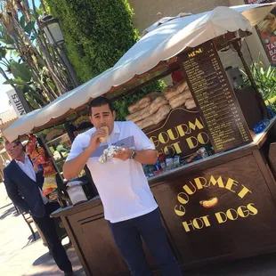 a man holding a hotdog