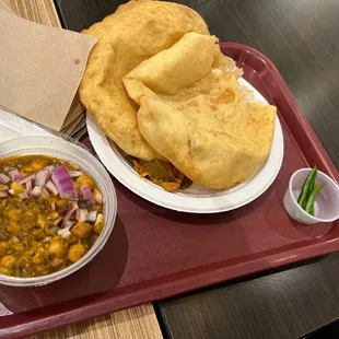 a plate of food on a tray