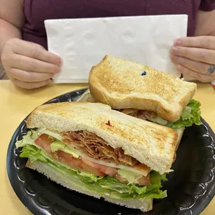 Bacon, lettuce, avocado, and tomato sandwich