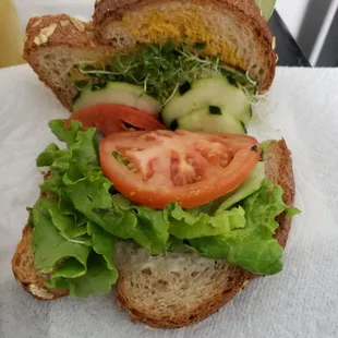 1.5 of veggie sandwich - 2 small pcs of lettuce, 1.1 slice of tomato, 3 cucumber halfs, and a 1/4c of spouts, mayo/mustard:/