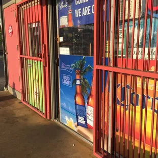a storefront with a red gate