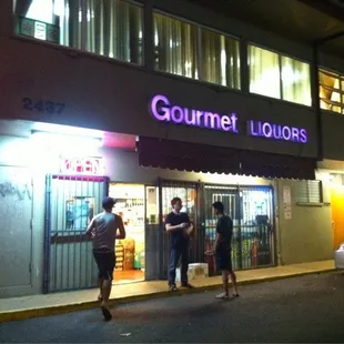 people walking in front of a store