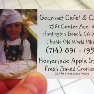 a picture of a girl holding a piece of bread