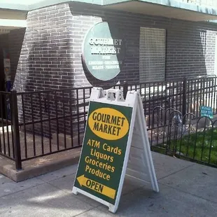 a sign for a gourmet market