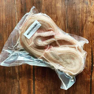 a piece of meat wrapped in plastic