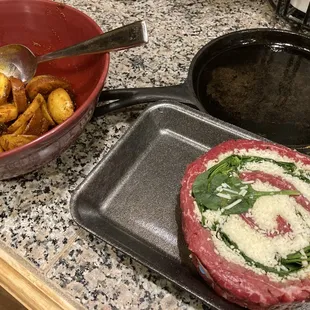 Stuffed with cheese and spinach with a side of seasoned potatoes.