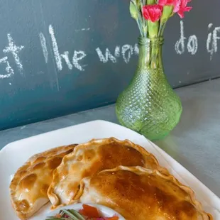 Baked beef, chicken and veggies empanadas with side of pico the galo