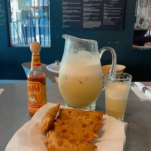 Fried Empanadas with fresh pineapple juice