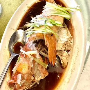 Steamed red rock cod with ginger and scallions.