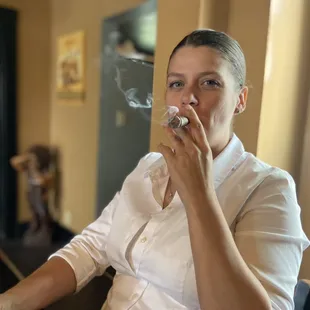 Anna Marquez smoking a Deadwood cigar.