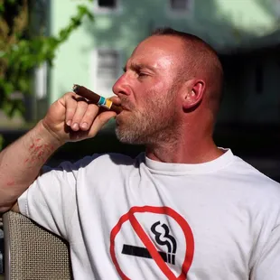 Jason Fry smoking an AVO cigar.